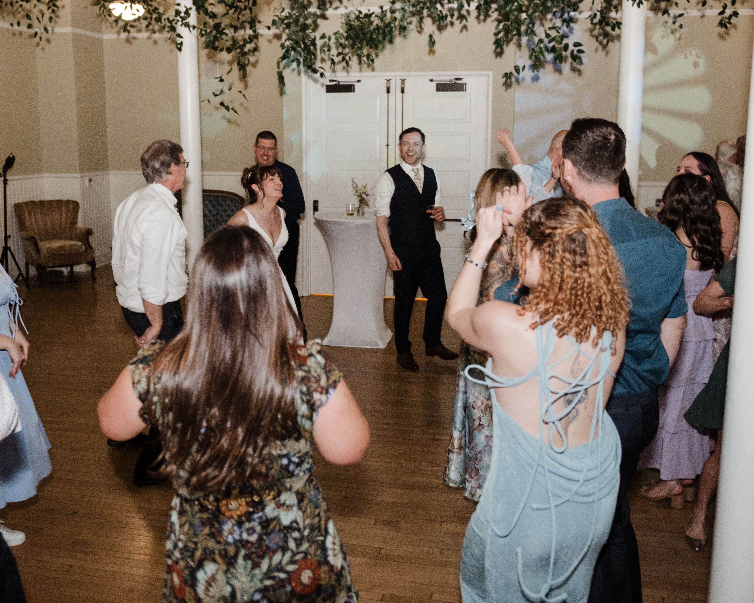 Amanda and Quintin Wedding Wedding guests dancing in a circle with the groom