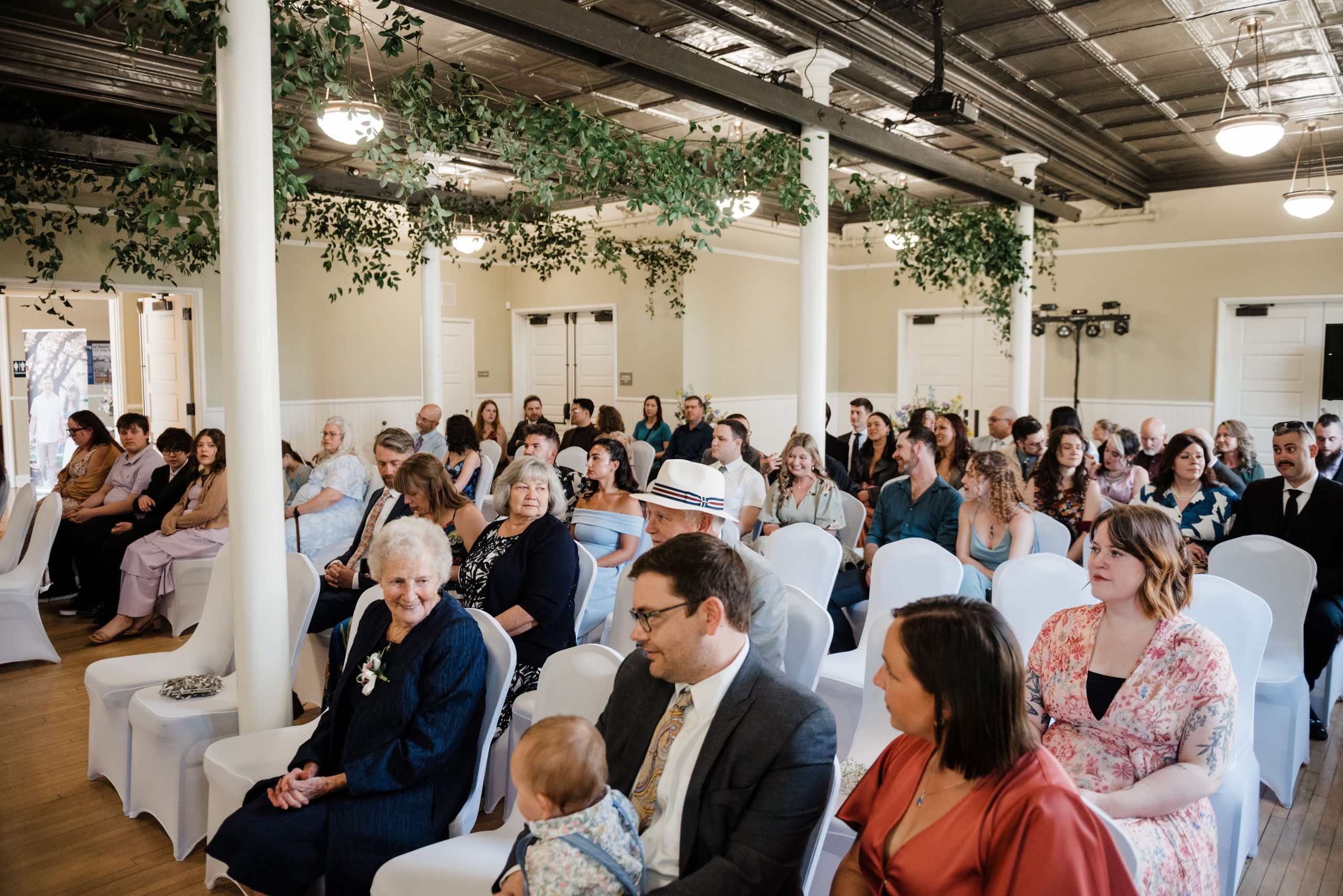 Amanda and Quintin Wedding Wedding guests seated in the Artillery Barracks waiting for the ceremony to begin