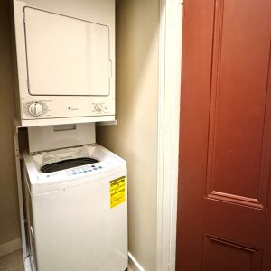 In-unit laundry closer with stacked washer and dryer