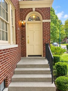 dx-523_front-door Cream front door with arched transom window set in brick at 523 Hatheway Rd.